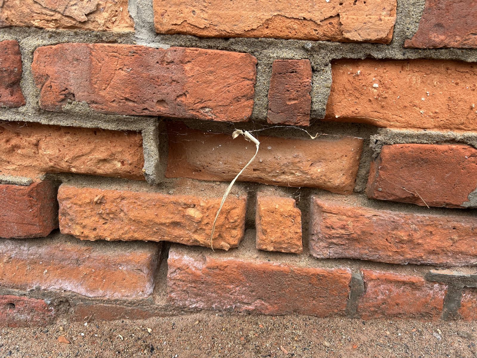 Close-up of weathered, eroded brickwork, photo 2 of 4